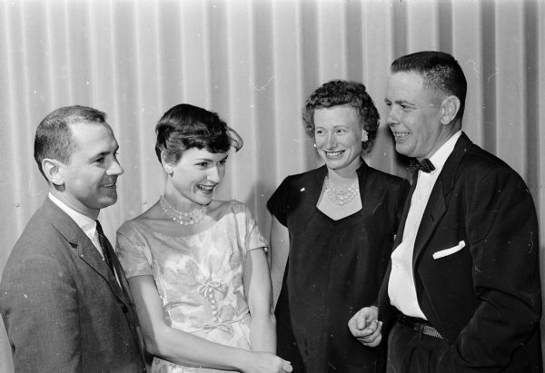Richard and Dorothy Trameri and Marguerite and Wesley Burke talk on the edge of the dance floor.