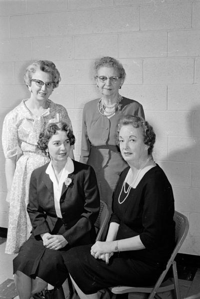 New officers of the auxiliary to the West Side Business Men's Association are shown. In front are Ethel Wood, vice-president, and  Mrs. Ned Lawrence, president. Standing in back, are Mary DiSalvo, secretary, and Caroline Blawusch, treasurer.