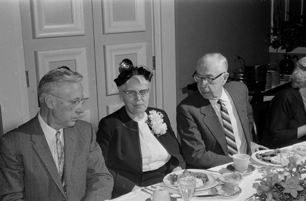 Dr. Amy Louise Hunter (Mrs. Fred Wilson), Director of the State Bureau of Child Health, is honored at a retirement dinner at the Simon House Supper Club. Shown (left to right) are: Dr. Carl N. Neupert, state health officer; Dr. Hunter; and Fred Wilson.