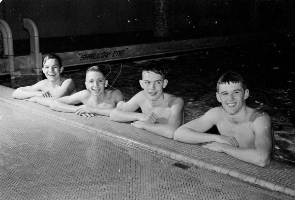 These four YMCA swimmers will be competing in the 160-yard freestyle relay hoping to earn a ninth victory. Left to right are: John Saunders, Cherokee Heights School; Dave Lewis, Van Hise School; Al Horner, Cherokee Heights School and Ralph Raymond, Van Hise School.