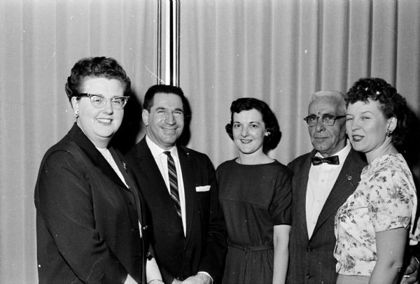Four members of the American Federation of Government Employees visit with the guest speaker at the dinner to celebrate the 78th anniversary of the United States Civil Service Act. Left to right are Doris Hanson, guest speaker Dr. Darrell J. Inabit who is the director of the United States Armed Forces Institute, Jeanne Ternes, Galen Day, and Carol Judd.