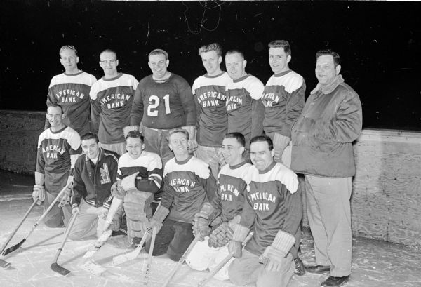 Group portrait of the American Exchange Bank hockey team that won the championship of the Madison Hockey League.