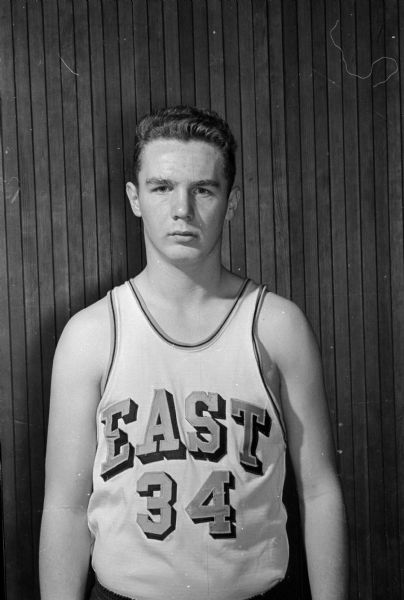 Portrait of Rod Haak, East High School basketball player in uniform.