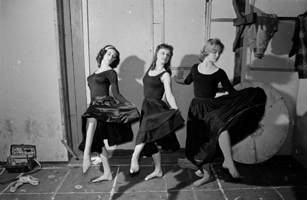 Three dancers rehearse for their roles in the Madison Theater Guild's production of "Carousel". On the left is Yvette Birs, who plays the lead dance role of the teen-age daughter, Louise. At right is her understudy, Peggy Harrer, a real teen-age dancer of 14. In the center is Gerri Glover, choreographer for the musical comedy.
