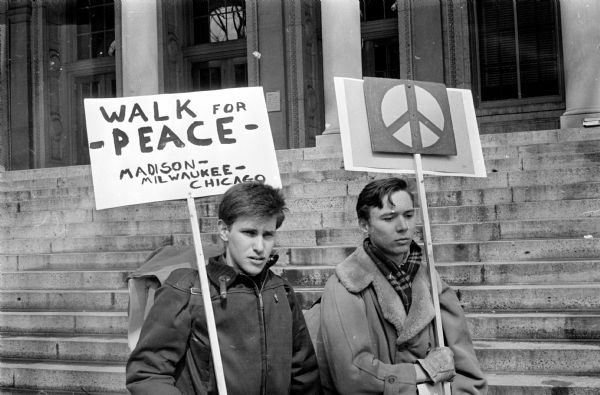 University of Wisconsin students John Peters and Bram Luckom leave Madison on a peace walk. Peters plans to walk to Rockford, IL and Luckom plans to walk to Chicago, IL to meet a group of pacifists who are walking to New York, NY from San Francisco, CA.