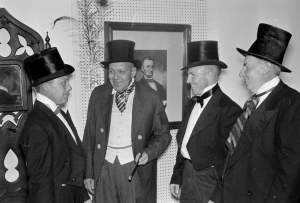 Employees of Mendota State Hospital act out the history of the hospital in a centennial pageant. In this scene, the hospital board visits the newly-built hospital. Left to right are: Casey Gloyd, hospital paint department; Dana W. Rockwell, chief engineer; Larry Novy, mason department; and Lewis Zalick, paint department.