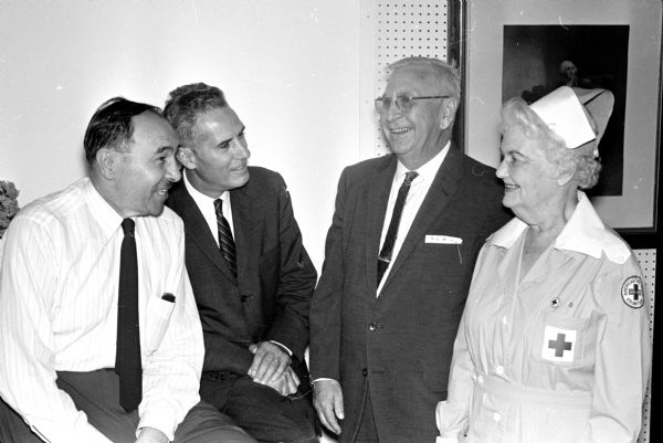 Present day hospital administrators consider the centennial pageant of the history of Mendota State Hospital a success. They are, left to right: Dr. Walter Urben, hospital superintendent; Steve Clark, administrative assistant of the Wisconsin State Employees Association; Ray Murphy, alcoholics counselor; and Mrs. C.A. Looeffelbain, American Red Cross.