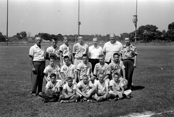 Group portrait of the 13 uniform wearing members of Middleton's Babe Ruth baseball team with their four coaches.