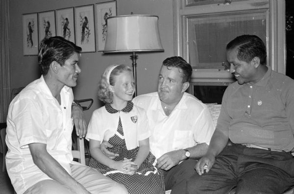 Joseph E. O'Brien (center) and his daughter, Mary Beth, 8, are shown at their Shorewood Hills home visiting with South American labor union leaders. Carlos Maria Cacerez, Ecuador, is on the right, and Joe Monge Vargas, Costa Rica, is on the left. They are two of the seven stopping in Madison on a two-month educational tour of the U.S.