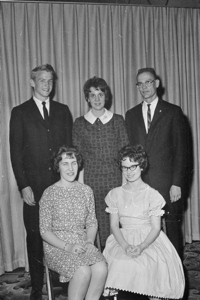 Group portrait of Madison High School students chosen as winners of the Elks youth leadership awards. Seated, left to right, their high school and award category are: Mary Louise Rather, Edgewood, girl leadership; and Joan Ranney, West, Constitution award. Back row: Paul Clay Sorum, West, winner of the State leadership award; Karen Ann Anderson, East, scholarship; and Ronald Dinteman, Central, scholarship.