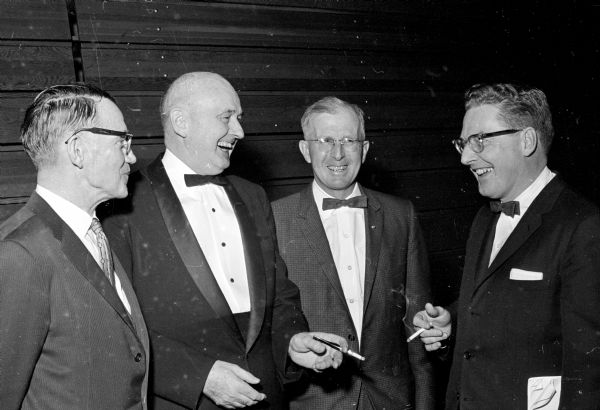 Attorney Lyall T. Beggs, second from the left, has a few funny stories to tell three assemblymen at the "Republi-Capers" Show at the Dane County Fairgrounds Arena. Left to right with Beggs are Elmer Genzmer (R-Mayville), Walter Calvert (R-Benton) and Robert Haase (R-Marinette).