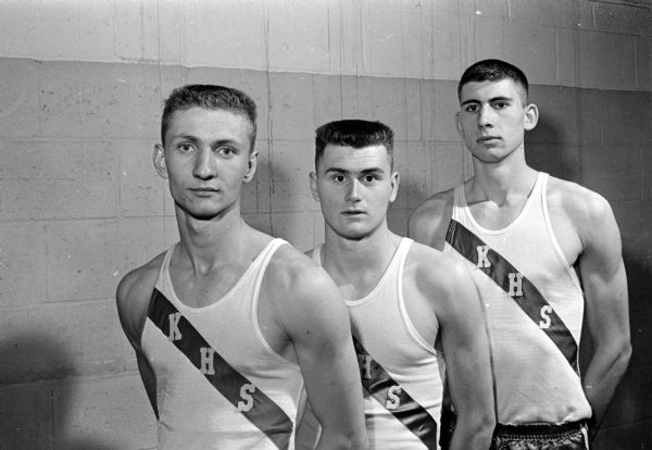 Members of the Kimberly High School track team that shares the Class B championship at the Madison West Relays held at the Camp Randall Memorial building. Shown left to right are: Ron Poleshinski, Bill Timmers, and Tom Rooyskkers. The trio won the high hurdle shuttle relay.