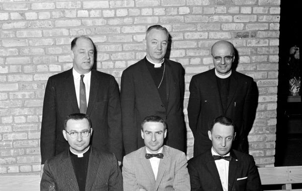 Leaders of the Milwaukee Diocese of the Episcopal Church and the Madison Churchmen's organization are shown at the Northwest Convocation of the organization. Front row, left to right: Rev. Edwin T. Wittenburg, Vicar of St. Luke's Episcopal Church in Madison; John Knight, secretary of the Madison Episcopal Churchmen; and John Oakley, chairman of the Madison group. Back row, left to right: Philip DeVeau, chairman of the Diocesan organization; the Rt.Rev. Donald H.V. Hallock, Bishop of the diocese; and the Rev. Stanley Atkins, who spoke at the convocation.