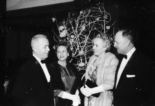 A group of guests attends the Civic Symphony Pops Concert in the Crystal  ballroom of the Hotel Loraine. They include, left to right: John and Mary Murphy and Mary and Mortimer Huber. The concert was a farewell event for Walter Heermann who was retiring after directing the orchestra for 13 years.