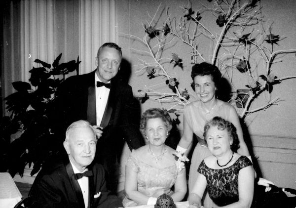 A group of guests attends the Civic Symphony Pops Concert in the Crystal Ballroom of the Hotel Loraine They include (seated), from left to right: Archie Kimball, Viola Ward, and Lucille Kimball. Standing are: Charles and Betty Vaughn. The concert was a farewell event for Walter Heermann who will be retiring after directing the orchestra for 13 years.