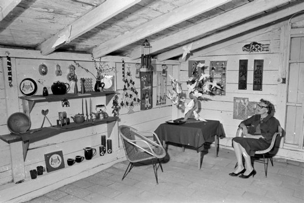 Jane Howell sits in the converted hen house that was turned into a gift house for the Altrusa club annual country fair.