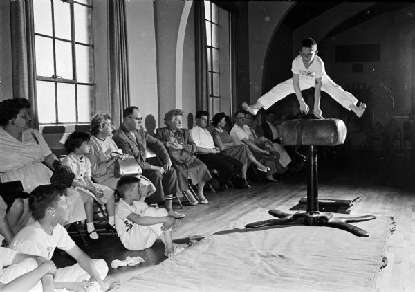 John Coyne takes part in a gymnastics demonstration at Turner Hall as part of Physical Fitness Week.
