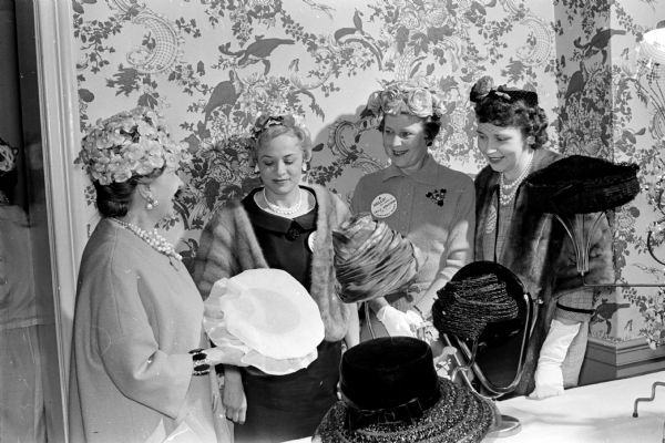Future lawyers' wives from the University of Wisconsin were guests at the luncheon of the Lawyers' Wives of Dane County. The program featured a talk on hats by Grace Weller, milliner at Simpson's Store.