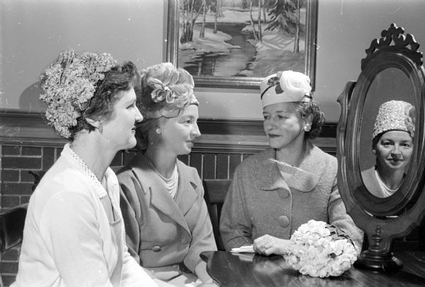 Barbara Blaedel, Sylvia Graf, and Mary Woelfel wear hats they designed and made, and will model at the University League brunch and program.