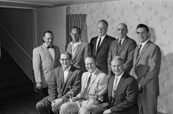 Madison Moose Lodge No. 1451 honored its 1960-61 bowling champions. Sitting are George Statz, singles winner and Larry Pagel and Ray Werrndli, doubles champions, of the Moose state bowling meet. Standing, left to right, are members of the league championship Ryan Chapel team: Howie Dorr, Glen Dorr, Paul Ryan Jr.,Dick Fischer, and Capt. Wayne Gibson. The Moose loop has 24 teams.