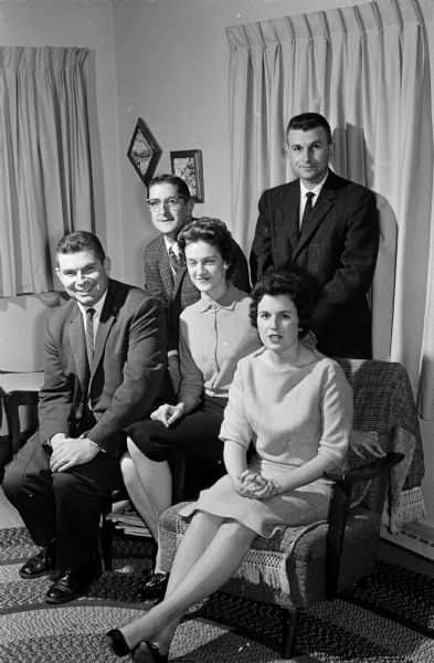 Group portrait of the committee planning the tenth class reunion of the 1951 Edgewood High School class. Seated, left to right, are: LeRoy Berigan, Carol Conners, and Patricia Quinn. Standing are Fred Meixner and James Mergen.