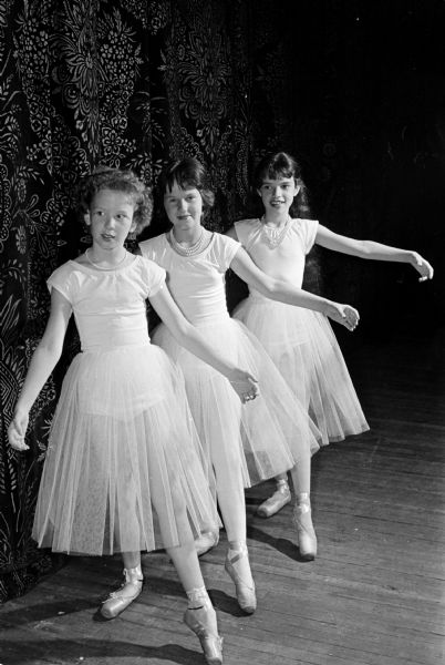 Ballet students rehearse for the Kehl School of Dance's 31st annual recital held in the Orpheum Theatre, entitled "Dance In." Shown left to right, are: Cathy Bewick, daughter of Mr. and Mrs. Wayne Bewick; Marlene Slawek, daughter of Mr. and Mrs. Boleslaw Slawek; and Joyce Perry, daughter of Mr. and Mrs. Roger K. Perry.