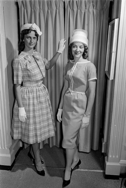 Members of the Alpha Sigma Alpha X, Beta Lota, Beta Omicron, and Beta Zeta chapters of the Epsilon Sigma Alpha Sorority sponsor the "Summer Hat Festival" luncheon and style show held at the Tree and the Poodle Dog, 212 State Street (later Paul's Club). Shown (L-R) modeling hats are Jackie Hill and Maxine Dailey.