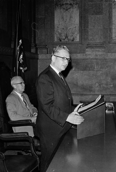 The new Wisconsin State Superintendent of Public Instruction, Angus B. Rothwell, gives a brief speech after taking the oath of office at the Wisconsin State Capitol. At left is first assistant superintendent Russell Lewis.