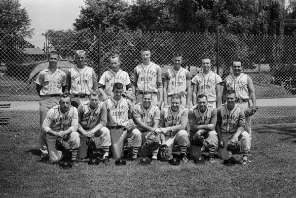 Group portrait of the Waunakee baseball team in uniform. The team is undefeated in the Home Talent League.