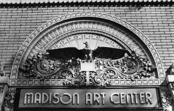 Ornate terra cotta work above the entrance of the Lincoln School building, 720 East Gorham Street, designed by Claude and Starck and built in 1915-16. The terra-cotta eagles over each main entrance were designed by George Elmslie. The eagle design was originally executed for a bank in Winona, Minnesota and the molds were reused for Lincoln School. At one time it housed the Madison Art Center, now it is an apartment building.