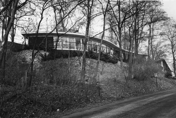Exterior view of the uniquely designed house of Byron Bloomfield at 1010 Edgehill Drive in Shorewood Hills, which is built into the side of a sharp slope. Bloomfield was the architect who designed the house in 1962 and lived there with his family.