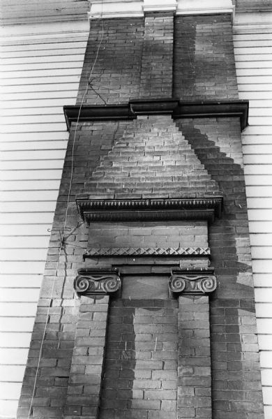An old, somewhat ornate chimney stands out from the side of the Elizabeth W. Pudor residence at 504 Wisconsin Avenue. The building has been converted to apartments.