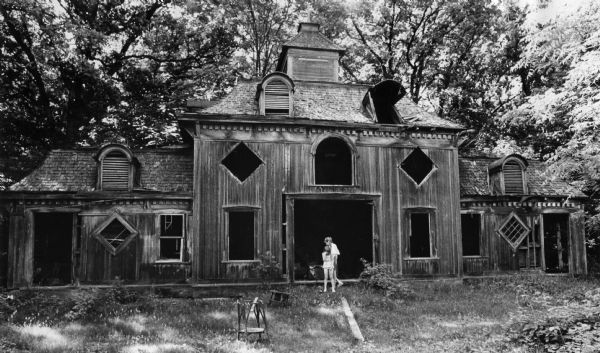 Exterior of exotic-looking Old Carriage House on the northeast edge of Lake Kegonsa in Stoughton. John Williams, a steel magnate from Youngstown, Ohio, used to summer on the property designed the building and had two Stoughton carpenters build the carriage house in 1887. There were no supporting beams for the second floor, instead the floor was hung from the ceiling on thick, steel rods.