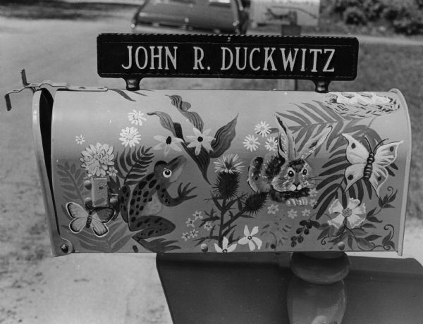 A mailbox, painted with likenesses of animals, insects, and plants, at the Duckwitz residence at 5040 Lake Mendota Drive.