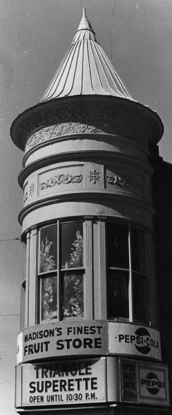 Round, ornate turret on the Triangle Superette, later known as the Triangle Market, on the corner of State and North Henry Streets.