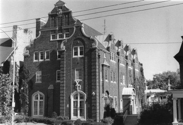 Exterior view of the brick Chi Omega Sorority House at 115 Langdon Street.