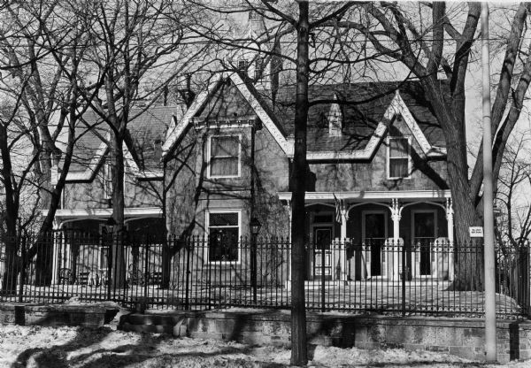 Exterior view of the Gothic sandstone house, 752 East Gorham Street. Later owned by Gordon and Dolly Harman.