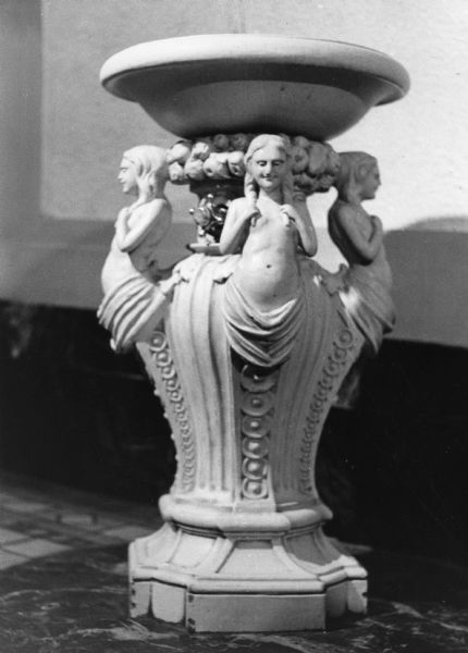 The ornate drinking fountain in the Capitol Theatre, which is decorated with smiling nymphs.