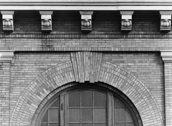 Carved stone details over a brick window arch on the exterior of the "Milwaukee Road" Depot, 644 West Washington Ave.  Chicago, Milwaukee, St. Paul & Pacific Railroad