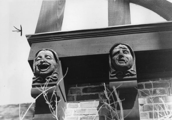 Wooden carvings of two faces (of a total of four) on the front of the L.W. Petterson house at 101 North Prospect Avenue which represent the "four ages of man". These two carvings represent adulthood and old age. The English Tudor-style home was built in 1925 by James Law, an architect and later Madison mayor. The carvings are traditional in the Tudor style of architecture.