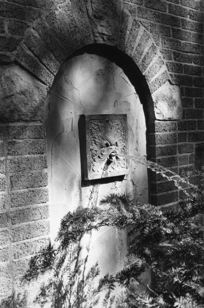 A gargoyle fountain on the side of the residence of Thomas Nelson at 3403 Circle Close in Shorewood.