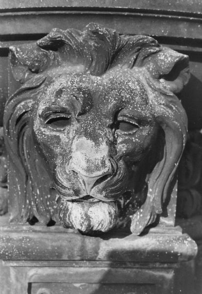 Metal lion head decoration seen at various entrances of the Wisconsin State Capitol.