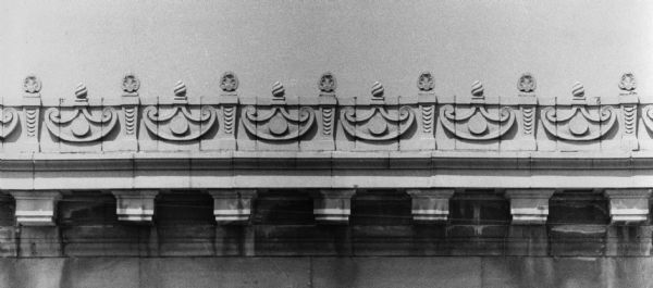 Greek-style decorative cornice on the facade of Sterling Hall at 475 North Charter Street.