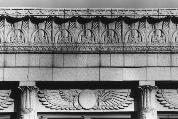 Egyptian Revival details carved in stone on the face of the Levitan Building at 15, 17, and 19 West Main Street.