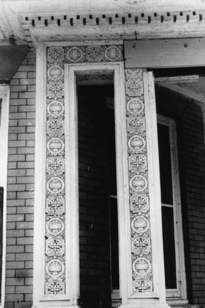 Detail from a house at 626 North Henry Street showing an art nouveau influence.