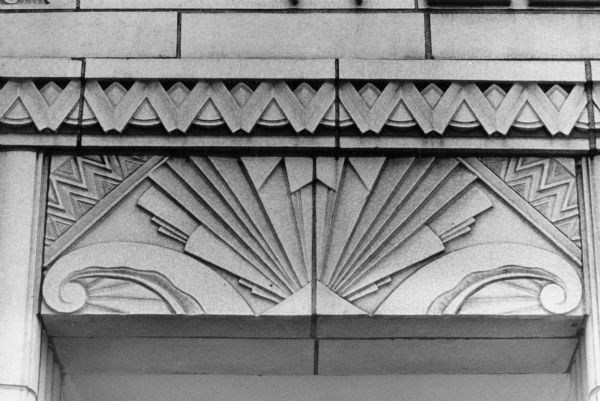 Art Deco detail above the entrance to Wells Printing Company at 121 West Main Street.