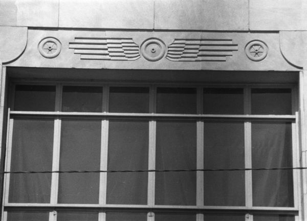 A wing and wheel design carved above a window at the Greyhound Bus Company terminal at 122 West Washington Avenue.