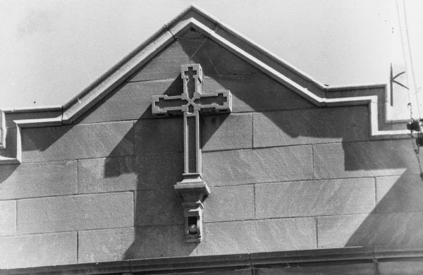 Cross detail on the exterior of Fitch-Lawrence Funeral Home at 626 University Avenue.