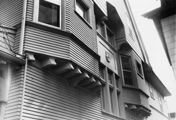 Outriggers used as bracket-like window casement supports on a house at 308 North Carroll Street.