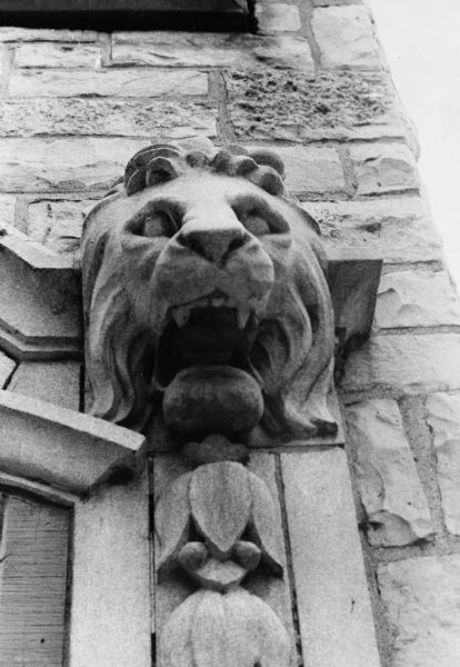 Carved lion head which serves as an ornament above the entrance of the Baccarat Tavern at 235 King Street.